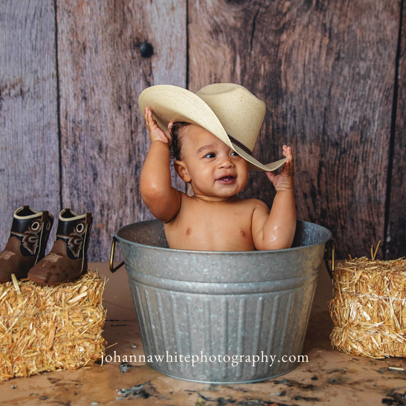 Baby cowboy in a wash basin bubble bath!
